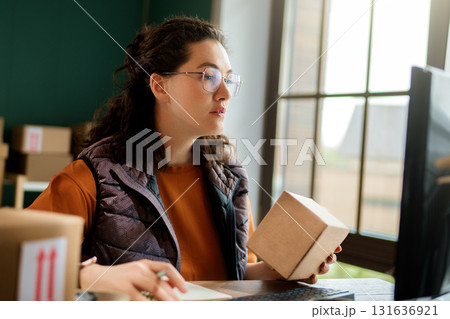 Woman working in a warehouse Woman working in a warehouse 131636921