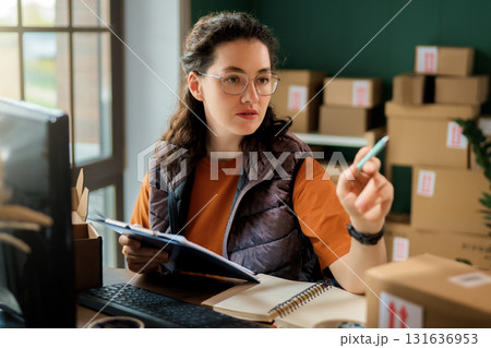 Woman working in a warehouse 131636953