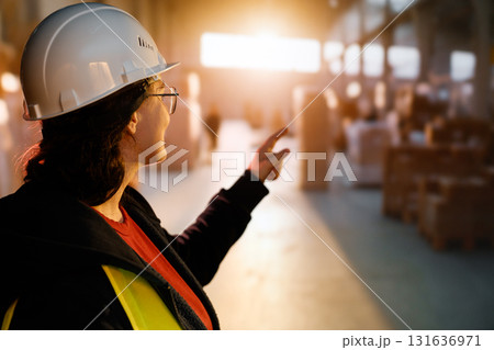 Young woman is working in warehouse 131636971