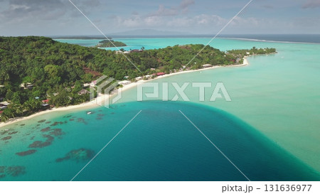 Stunning drone aerial tropical island paradise with turquoise water, lush vegetation, white sandy beaches, showcasing the beauty of nature and inviting relaxation. Stunning natural background. Stunning drone aerial tropical island paradise with turquoise water, lush vegetation, white sandy beaches, showcasing the beauty of nature and inviting relaxation. Stunning natural background. 131636977
