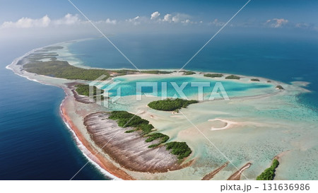 French Polynesia, Rangiroa island: Aerial view of largest atoll in the Tuamotu archipelago, featuring a turquoise lagoon and coral reef. Wild nature travel landscape. Drone flight panorama French Polynesia, Rangiroa island: Aerial view of largest atoll in the Tuamotu archipelago, featuring a turquoise lagoon and coral reef. Wild nature travel landscape. Drone flight panorama 131636986