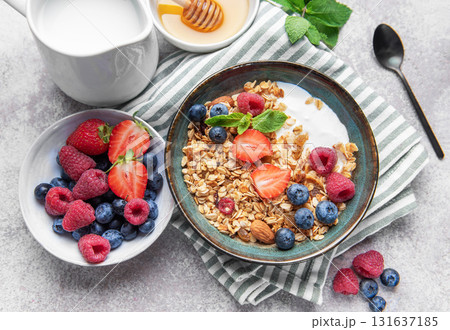 Granola bowl with yogurt, berries, and mint for breakfast 131637185