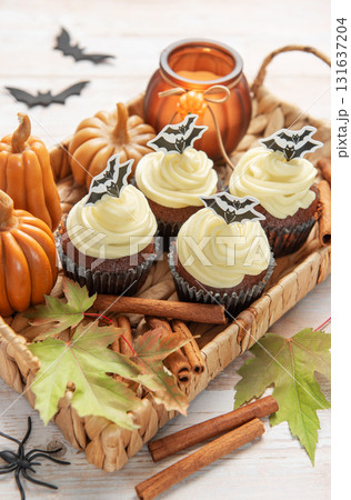 Halloween cupcakes with bat decoration and autumn elements 131637204