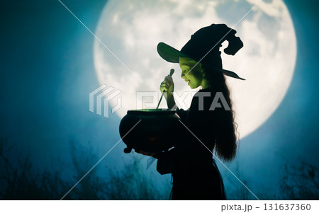 Girl dressed in witch costumes for Halloween Girl dressed in witch costumes for Halloween 131637360
