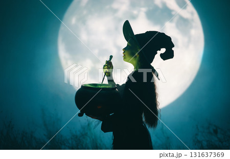 Girl dressed in witch costumes for Halloween Girl dressed in witch costumes for Halloween 131637369