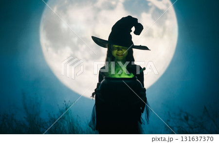 Girl dressed in witch costumes for Halloween Girl dressed in witch costumes for Halloween 131637370