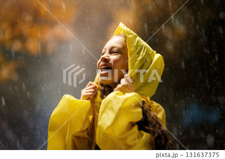 girl in the rain on an autumn walk 131637375