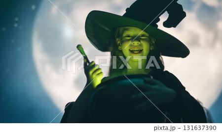 Girl dressed in witch costumes for Halloween Girl dressed in witch costumes for Halloween 131637390
