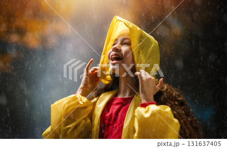 girl in the rain on an autumn walk 131637405