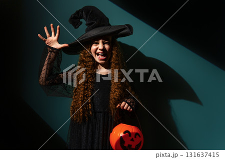 girl with Halloween pumpkin girl with Halloween pumpkin 131637415