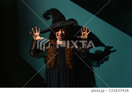 Girl is celebrating Halloween Girl is celebrating Halloween 131637426