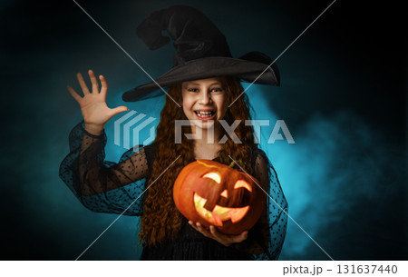 girl with Halloween pumpkin girl with Halloween pumpkin 131637440
