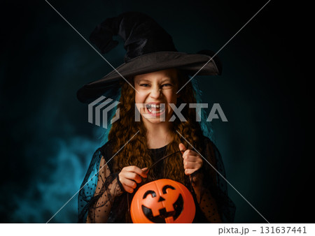 girl with Halloween pumpkin girl with Halloween pumpkin 131637441