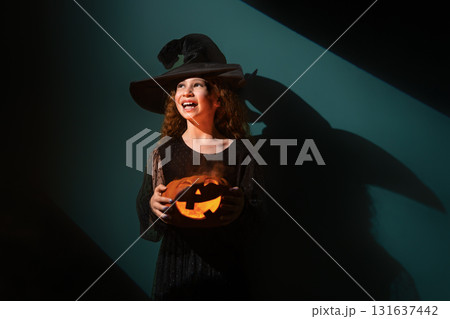 girl with Halloween pumpkin girl with Halloween pumpkin 131637442