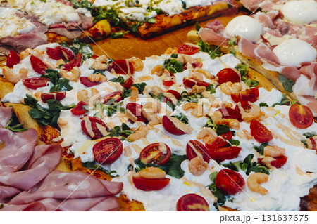 pizza al taglio with different toppings in Italy 131637675