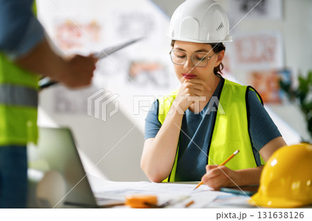 Team of architects working on plans 131638126