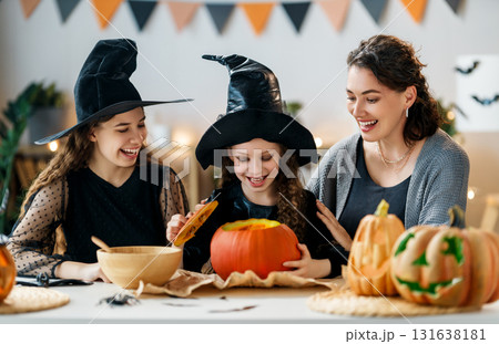 Happy family preparing for Halloween. Happy family preparing for Halloween. 131638181