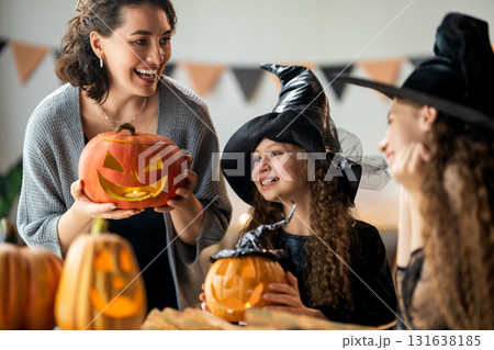 Happy family preparing for Halloween. Happy family preparing for Halloween. 131638185