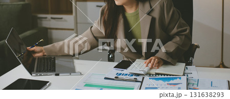 Portrait of young Hispanic professional business woman standing in office. Happy female company executive, smiling businesswoman entrepreneur corporate leader manager looking at camera using tablet Portrait of young Hispanic professional business woman standing in office. Happy female company executive, smiling businesswoman entrepreneur corporate leader manager looking at camera using tablet 131638293