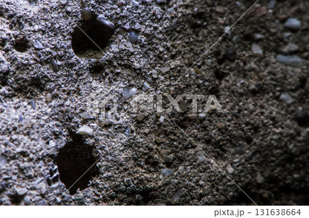 A close-up of a stone shows its relief 131638664