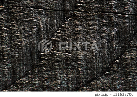 Deep furrows and cracks create a multi-layered wood texture 131638700