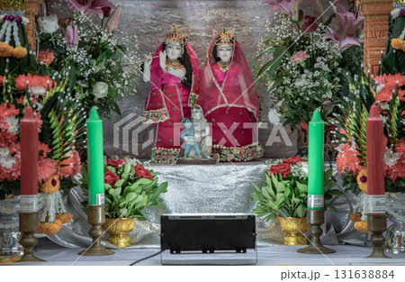 The statue features the Hindu deities Radha and Krishna. The display is a form of worship and a way to celebrate the Navaratri festival. The statue features the Hindu deities Radha and Krishna. The display is a form of worship and a way to celebrate the Navaratri festival. 131638884