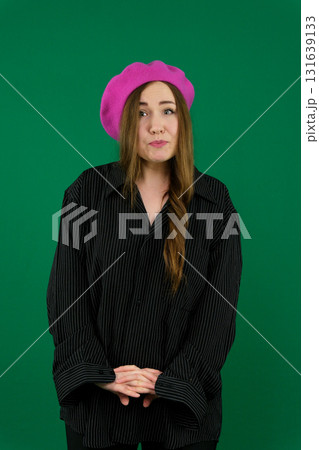 Set of videos featuring young European woman in pink beret showing various emotions and gestures on green chroma key background with copy space for advertising and social media design 131639133