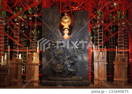Mahisasuramardini Goddess Durga with Divine Family and Ornate Backdrop 131640675
