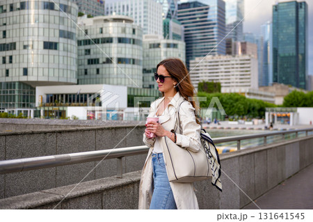 Business woman walking with bag city street Business woman walking with bag city street 131641545