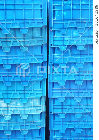 Stacks of modern blue plastic crates or containers 131641586
