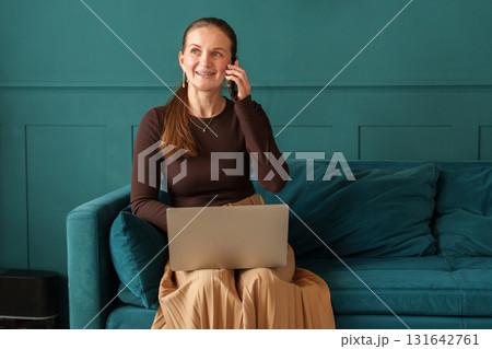 Portrait of woman working from home on laptop Portrait of woman working from home on laptop 131642761