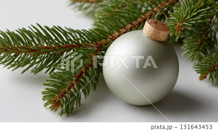 Christmas tree ornament hanging on pine branch 131643453