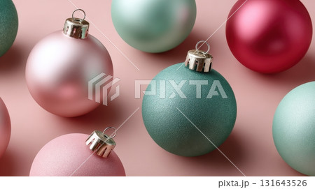 Pastel Christmas ornaments scattered on a pink surface Pastel Christmas ornaments scattered on a pink surface 131643526