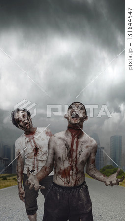 Indonesian southeast asian scary male zombies with wounds and blood were walking in the middle of an apocalyptic city under dark cloudy sky. The scene is scary and creepy. Concept of Spooky Halloween Indonesian southeast asian scary male zombies with wounds and blood were walking in the middle of an apocalyptic city under dark cloudy sky. The scene is scary and creepy. Concept of Spooky Halloween 131644547