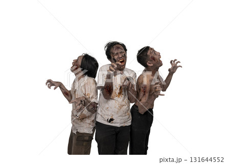 Portrait of three Indonesian southeast asian scary male zombies with wounds and blood on their bodies isolated over a white background. Spooky expression. Concept of Halloween or Horror Portrait of three Indonesian southeast asian scary male zombies with wounds and blood on their bodies isolated over a white background. Spooky expression. Concept of Halloween or Horror 131644552