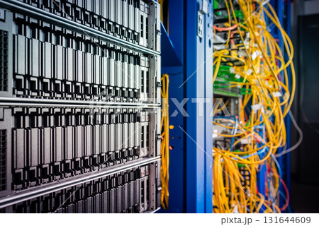 cluster of data storage SSD hard drives inside server rack 131644609