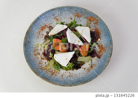 Greek salad on dark background. top view. Healthy food. Greek salad on dark background. top view. Healthy food. 131645226