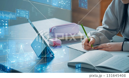 タブレットを見ながら勉強する女の子とデジタルテクノロジー タブレットを見ながら勉強する女の子とデジタルテクノロジー 131645408
