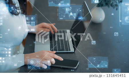 ノートパソコンを使う女性とデジタルテクノロジーイメージ ノートパソコンを使う女性とデジタルテクノロジーイメージ 131645451