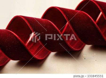Luxurious Red Velvet Ribbon Flowing Elegantly for a Festive Christmas Celebration Background 131645531