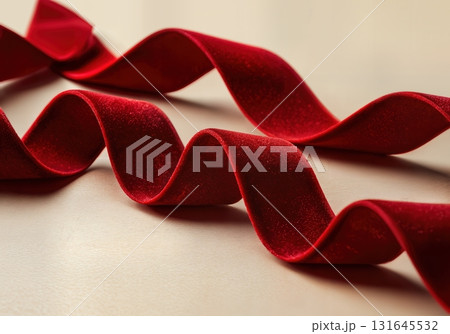Luxurious Red Velvet Ribbon Flowing Elegantly for a Festive Christmas Celebration Background Luxurious Red Velvet Ribbon Flowing Elegantly for a Festive Christmas Celebration Background 131645532