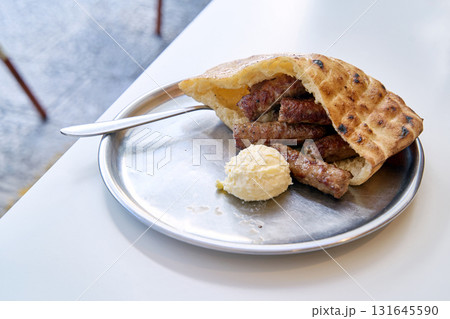 Sarajevo-style cevapi aka Sarajevski cevapi a national dish of Bosnia and Herzegovina Sarajevo-style cevapi aka Sarajevski cevapi a national dish of Bosnia and Herzegovina 131645590