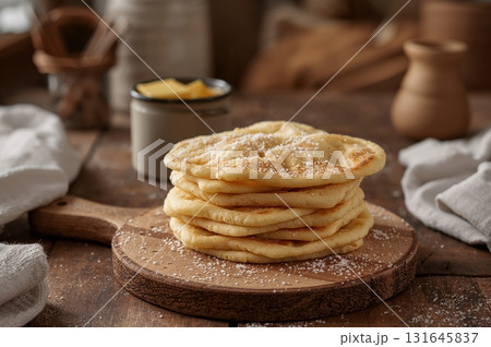 Norwegian Lefse flatbread stacked warm with butter sugar in rustic kitchen Norwegian Lefse flatbread stacked warm with butter sugar in rustic kitchen 131645837