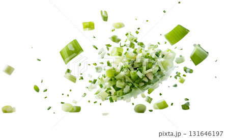 Assortment of freshly chopped green vegetables including celery bell peppers and herbs scattered against a plain white background 131646197
