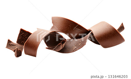 Close up of delicious shiny dark chocolate curls or shavings arranged on a plain white background showcasing the rich Close up of delicious shiny dark chocolate curls or shavings arranged on a plain white background showcasing the rich 131646203