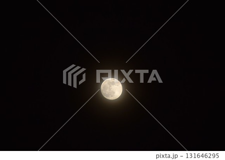yellow full moon covering by cloud floating on sky in night background yellow full moon covering by cloud floating on sky in night background 131646295