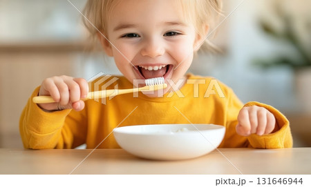 A parent joyfully assisting their young child in brushing their teeth highlighting the importance of dental hygiene and the nurturing bond between family members during a daily morning routine A parent joyfully assisting their young child in brushing their teeth highlighting the importance of dental hygiene and the nurturing bond between family members during a daily morning routine 131646944