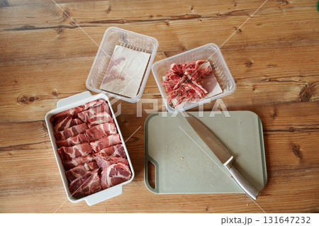 Preparing raw pork meat for cooking 131647232
