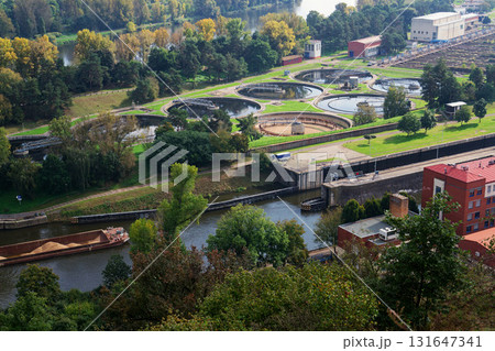 Aerial view of storage tanks, sewage water treatment plant, water shortage and global warming concept Aerial view of storage tanks, sewage water treatment plant, water shortage and global warming concept 131647341