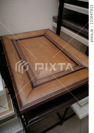 A stack of kitchen cabinet samples in different colors and textures A stack of kitchen cabinet samples in different colors and textures 131647915